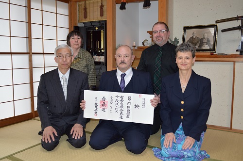 Receiving his 7th Dan from the Doshu